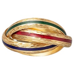 Un anello Hermes con trinità in oro 18 ct e smalto