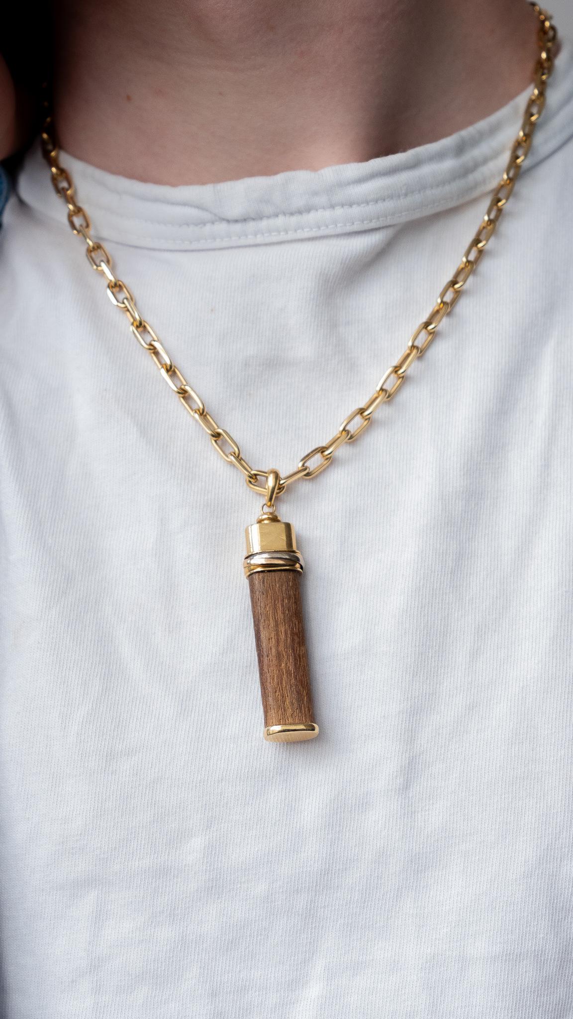 An 18k Gold and Wood Cartier Good Luck Pendant In Good Condition For Sale In Amsterdam, NL
