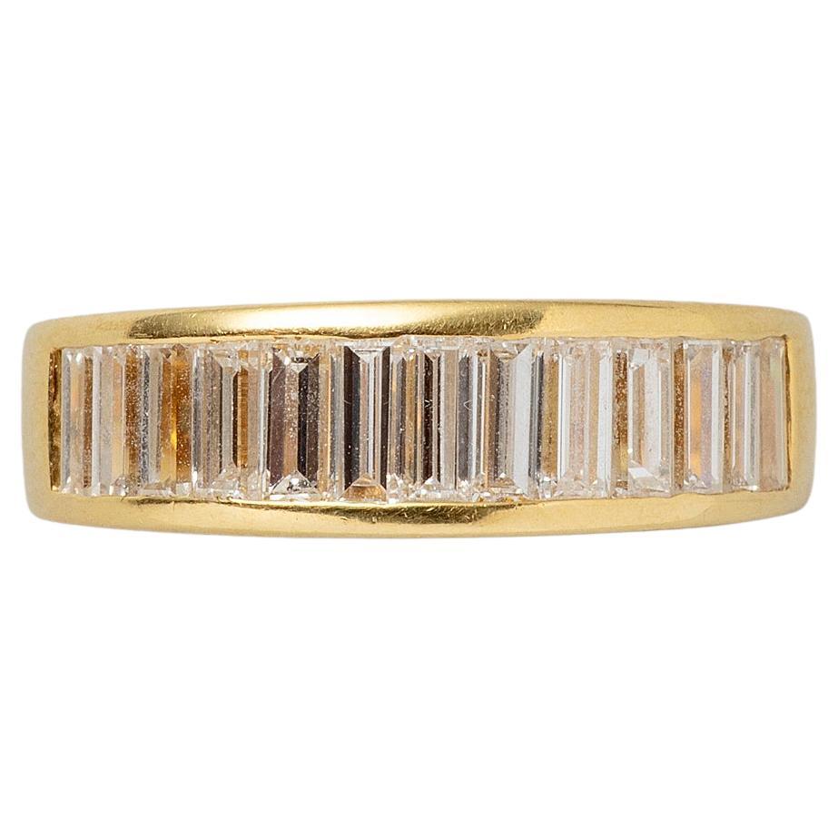 An 18k Gold Band Ring with Baguette Cut Diamonds For Sale