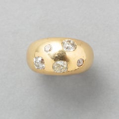 An 18k Gold Bombé Ring with Old Cut Diamonds