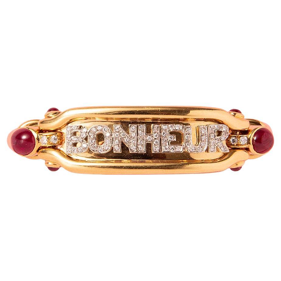 An 18K Gold Bonheur Bracelet with Diamonds and Ruby