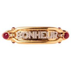 An 18K Gold Bonheur Bracelet with Diamonds and Ruby