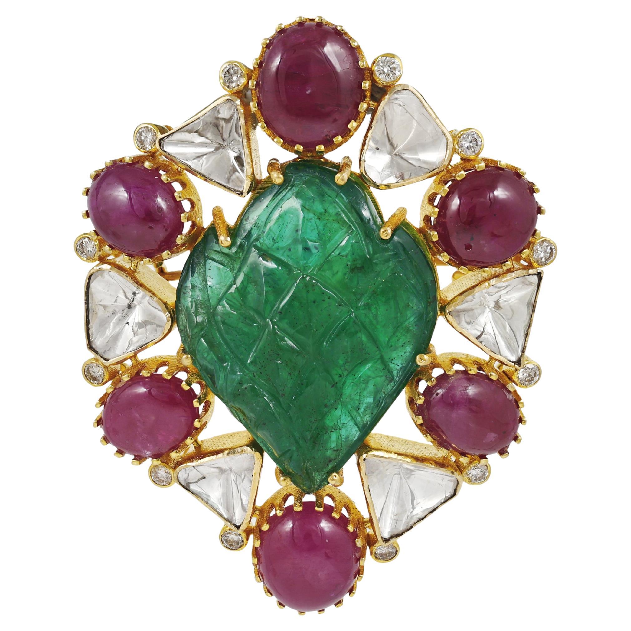An 18K gold brooch cum pendant set with zambian emerald, rubies and diamonds