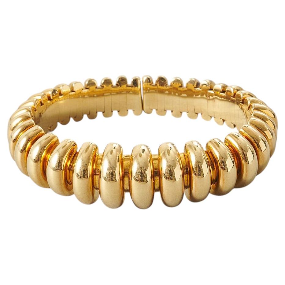 An 18k Gold Bulgari Celtaura Ribbed Bangle