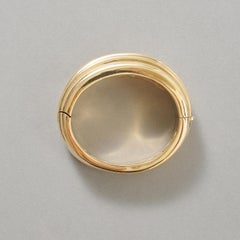 An 18k Gold Cartier Bangle
