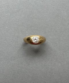 An 18k Gold Cartier Ring with a Flush set Solitair Diamond