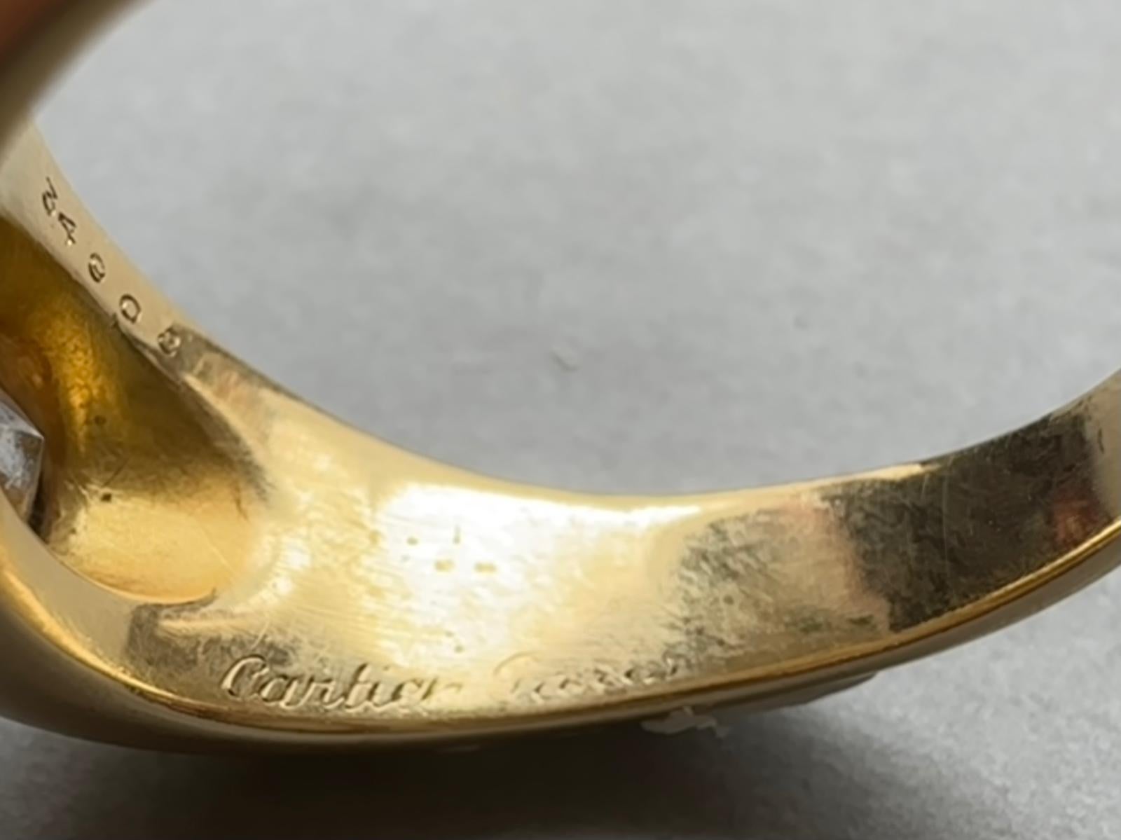 Brilliant Cut An 18k Gold Cartier Ring with a Flush set Solitair Diamond For Sale