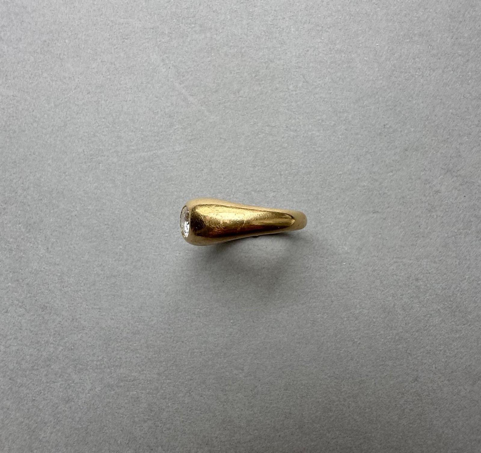 Women's or Men's An 18k Gold Cartier Ring with a Flush set Solitair Diamond For Sale