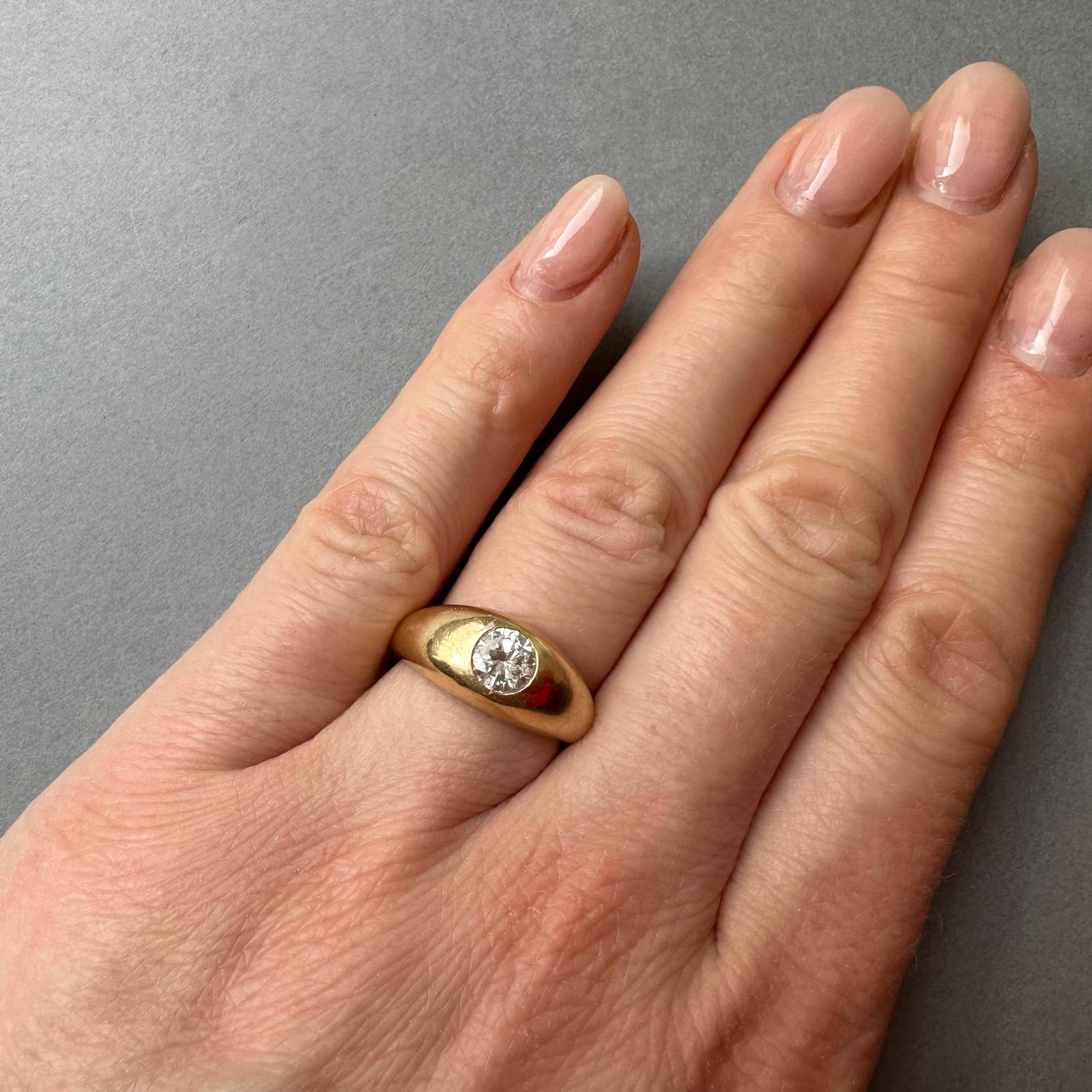 An 18k Gold Cartier Ring with a Flush set Solitair Diamond For Sale 1