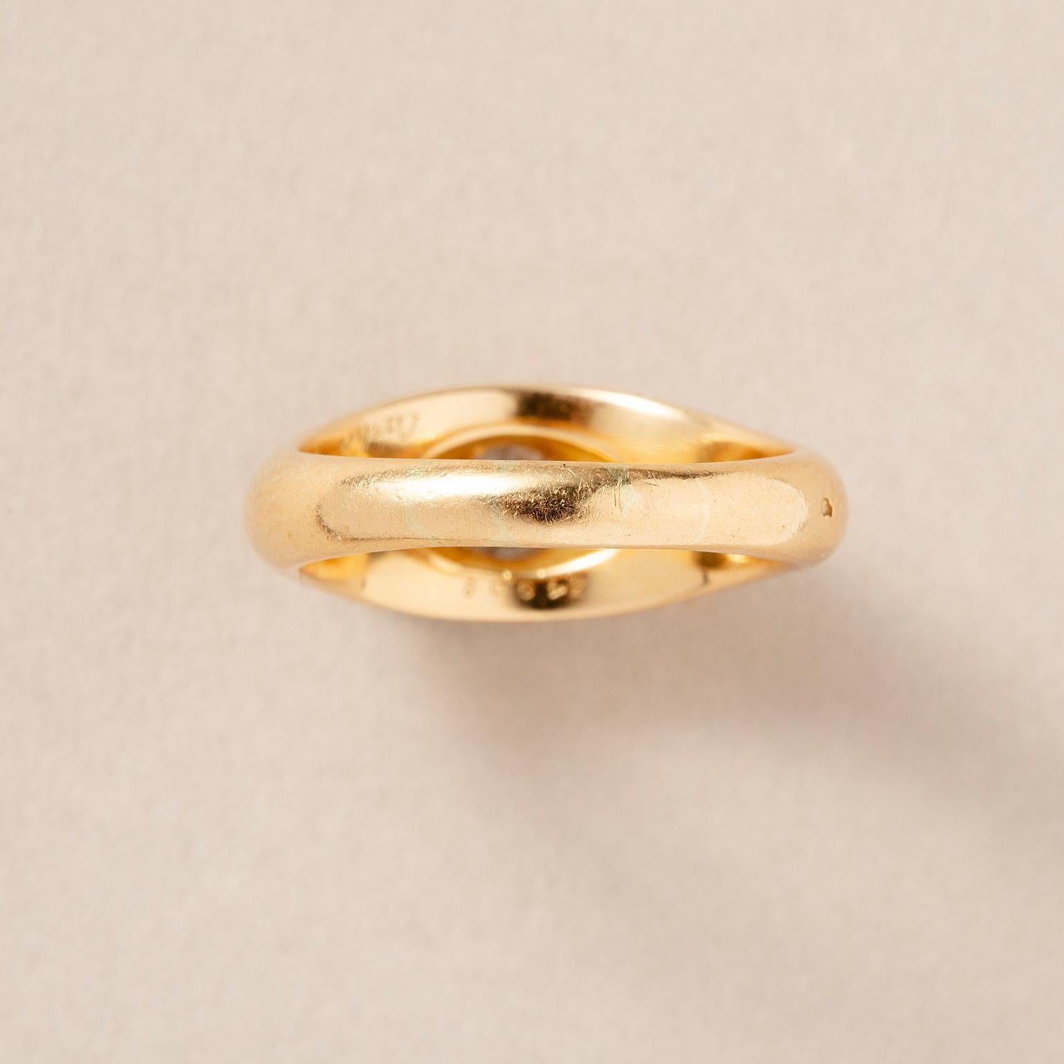 An 18k Gold Cartier Ring with a Flush set Solitair Diamond For Sale 4