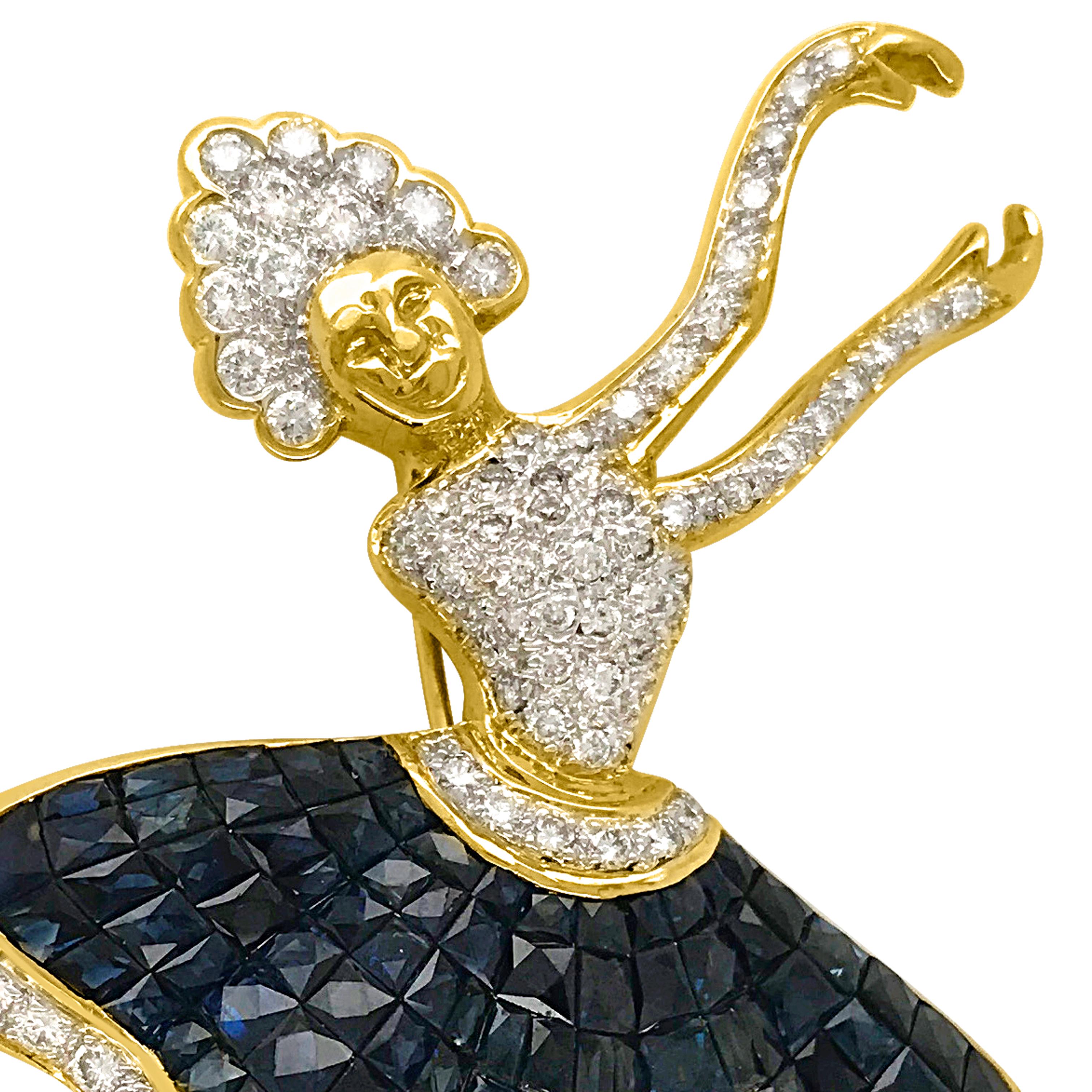This outstanding Ballerina brooch pin is handcrafted in solid 18K yellow gold weighing approx. 15.4 grams, measuring 60*45mm. It features a dancing Ballerina calibrated 112 modified rectangular-cut sapphires in invisible settings, cumulatively
