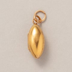 An 18k Gold Egg Shaped Locket Pendant