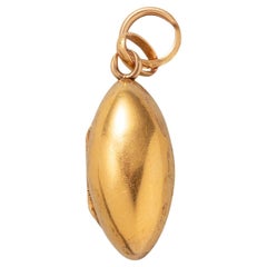 An 18k Gold Egg Shaped Locket Pendant