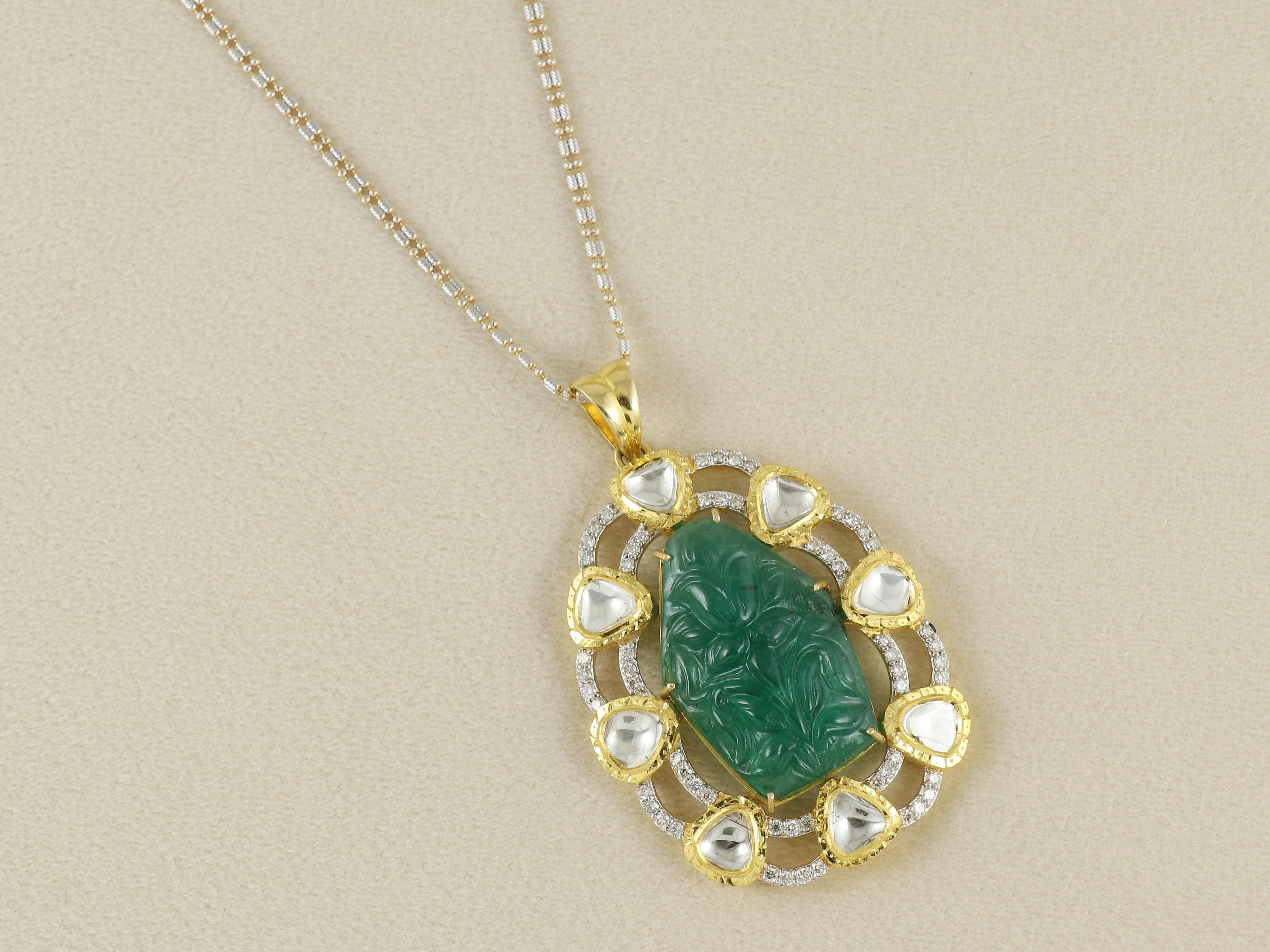 A poetic expression of natural beauty and masterful Indian craftsmanship, this statement pendant features a rare 35+ carat natural Zambian emerald, exquisitely carved in the form of a blooming flower bud — a motif deeply symbolic of awakening,