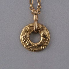 An 18k Gold French Sagittarius Pendant