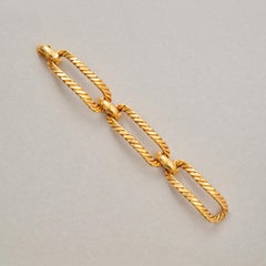 Un bracciale Georges Lenfant in oro 18 carati