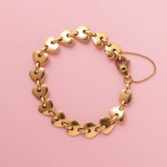 An 18k Gold Heart Link Bracelet