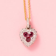 An 18k Gold Heart Locket with Diamond and Ruby