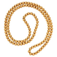 Lange Kette aus 18 Karat Gold mit satinierten Kugeln
