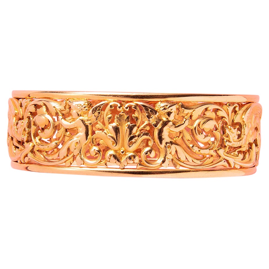 An 18k Gold Lucien Gaillard Bangle with Dragons
