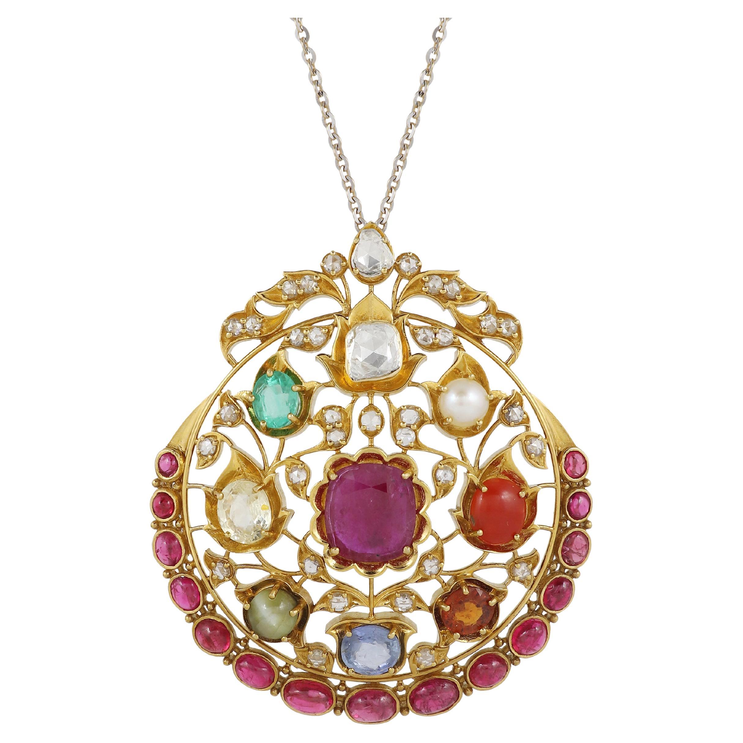 An 18K gold Navratna pendant set with nine natural gemstones with diamond For Sale