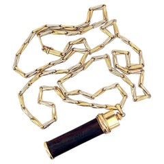 An 18k gold "Touch wood" pendant with matching chain by Cartier.