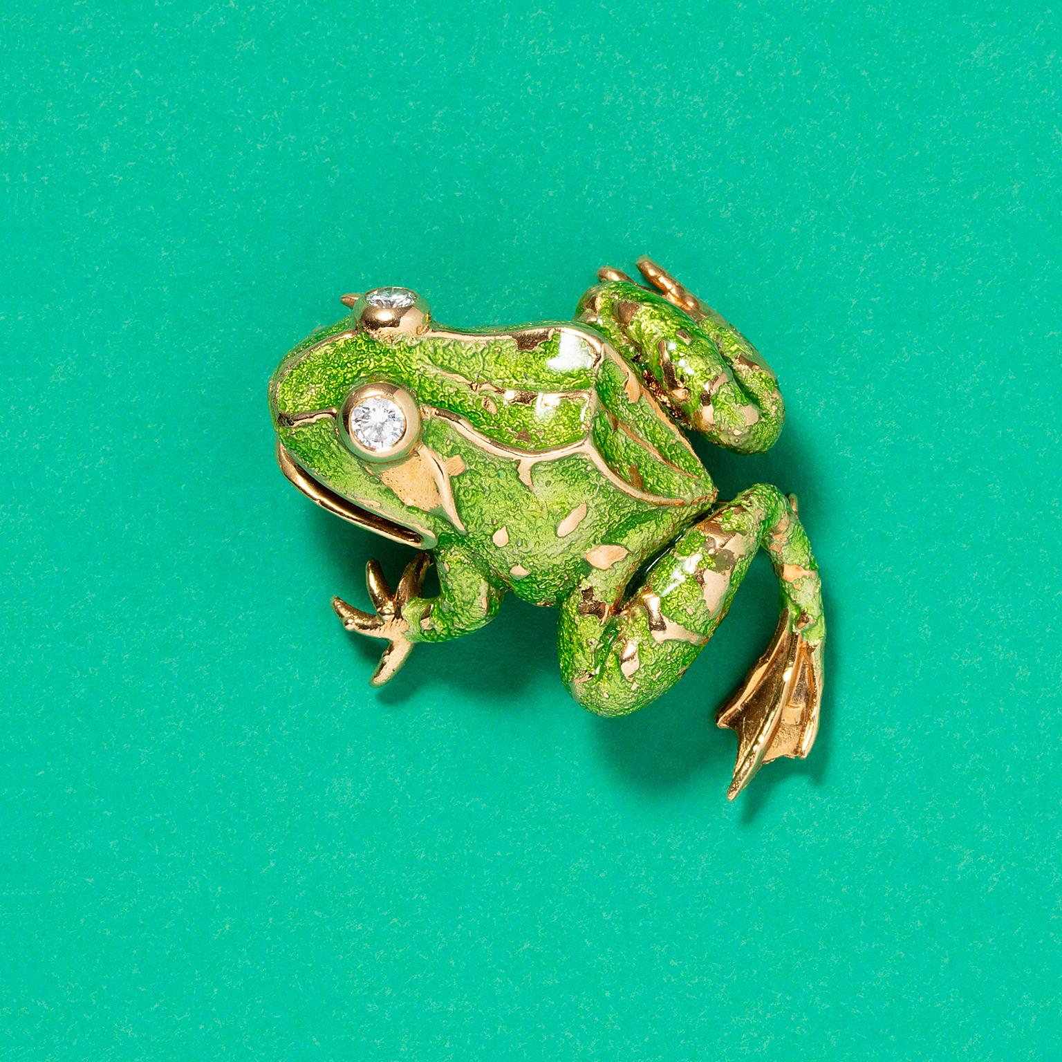 A sweet 18k gold frog brooch with green enamel and diamond eyes, signed, numbered and dated: Van Cleef and Arpels, B4397.750 France, 1965 with the master mark Ste. J. for Atelier Janca.

Weight: 13.4 grams
Dimensions: 36 mm