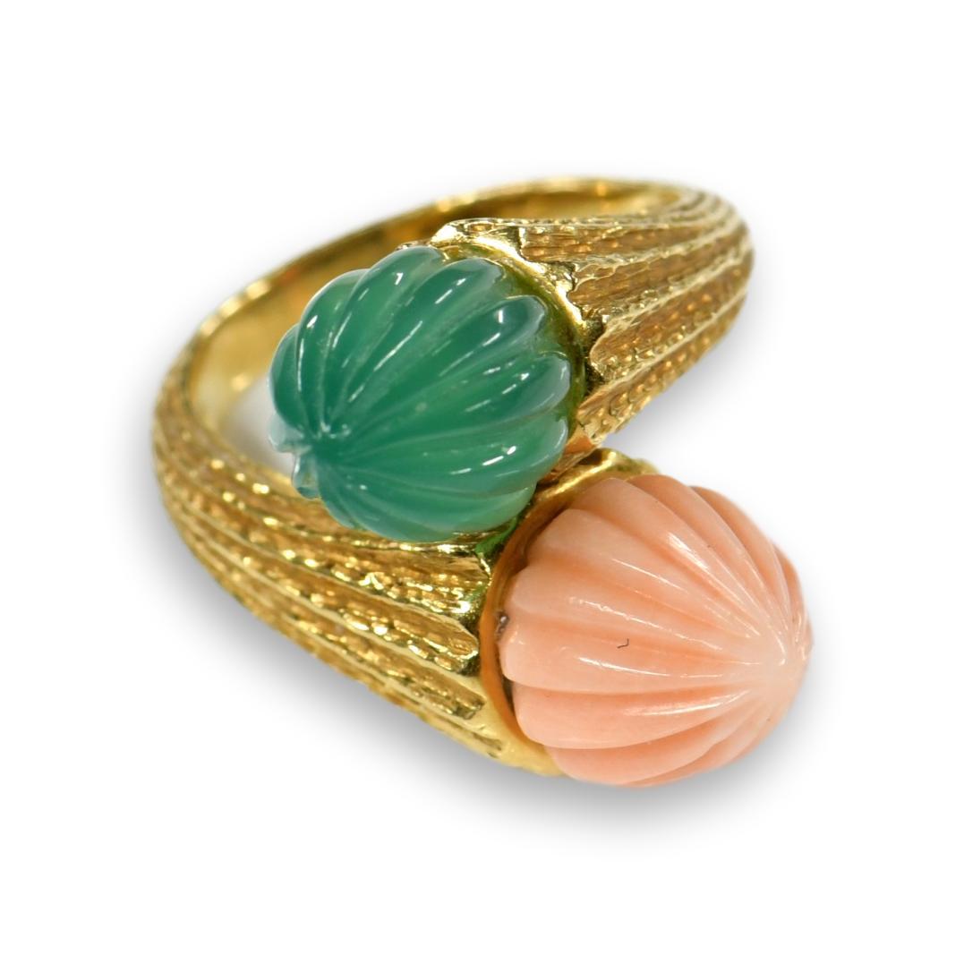 An Exquisite coral and Chalcedony ring are nestled together to create Toi et Moi ring. The French call this shape 