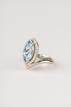 18 Karat White Gold, 2.29 Carat Marquise Aquamarine Ring with a Diamond Halo