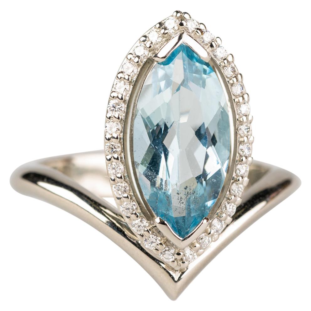 18 Karat White Gold, 2.29 Carat Marquise Aquamarine Ring with a Diamond Halo