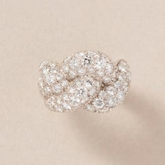 An 18k White Gold Braided Knot Ring with Diamonds