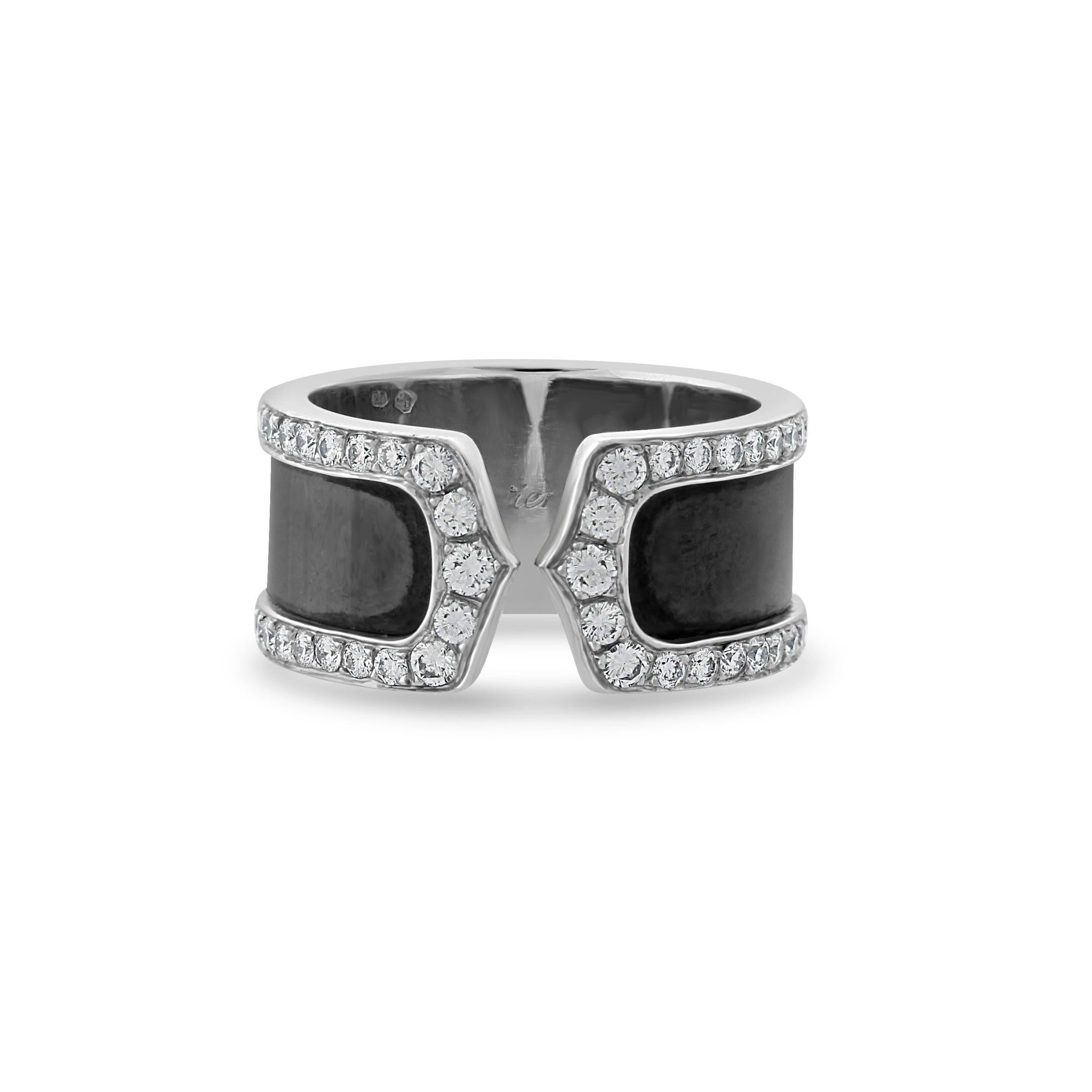 A classic contemporary ring by Cartier from the ‘Double C de Cartier’ collection. This 18k white gold ring is set with approximately 1.25 carats of brilliant cut diamonds framing the black lacquer centre converging on the iconic two C’s. The ring is