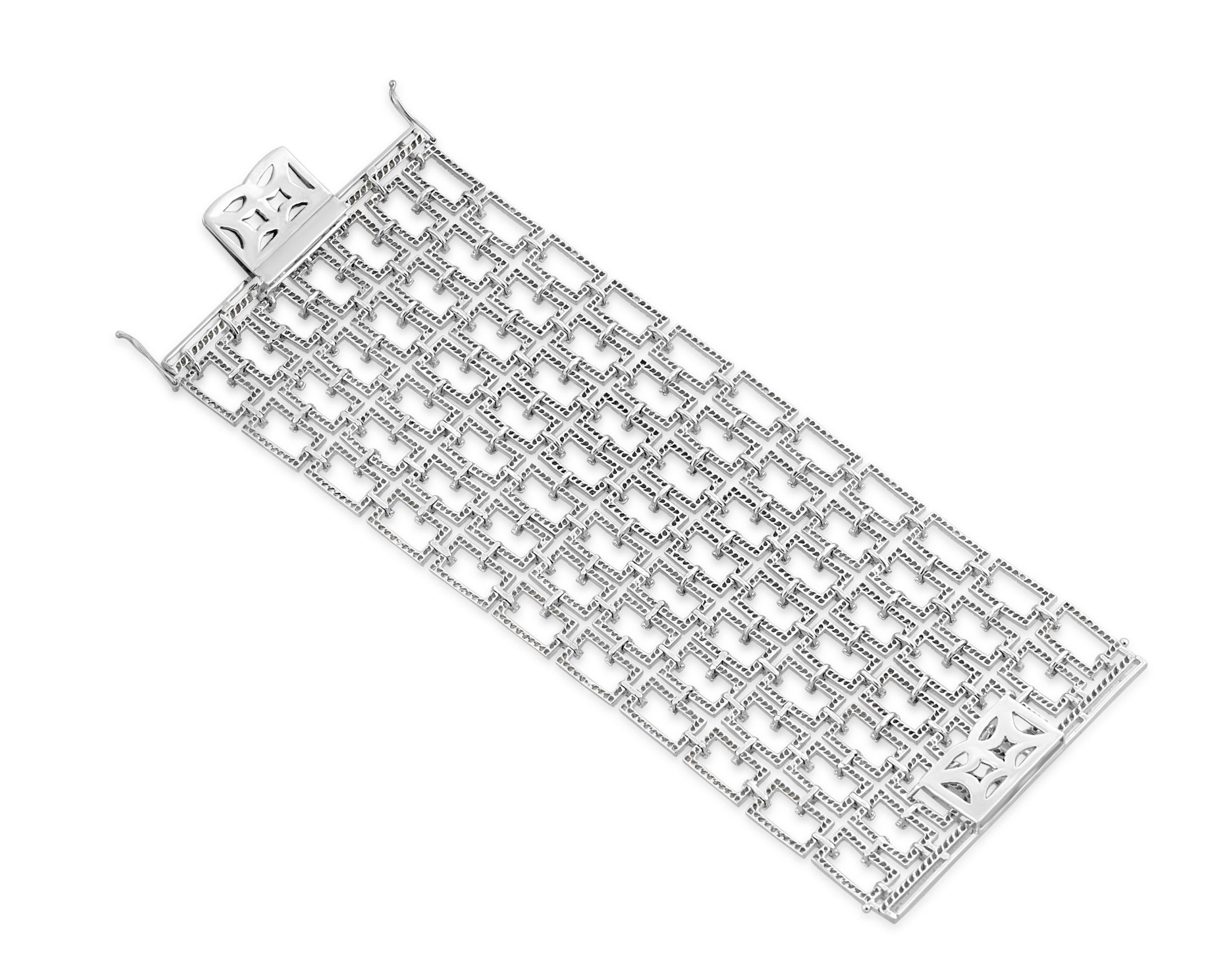 An 18k white gold and diamond bracelet in a rectangular panel openwork lattice design. A statement contemporary piece, this is an elegant and glamorous bracelet perfect for evening wear. Set with approximately 20-22 carats of diamonds in total, of