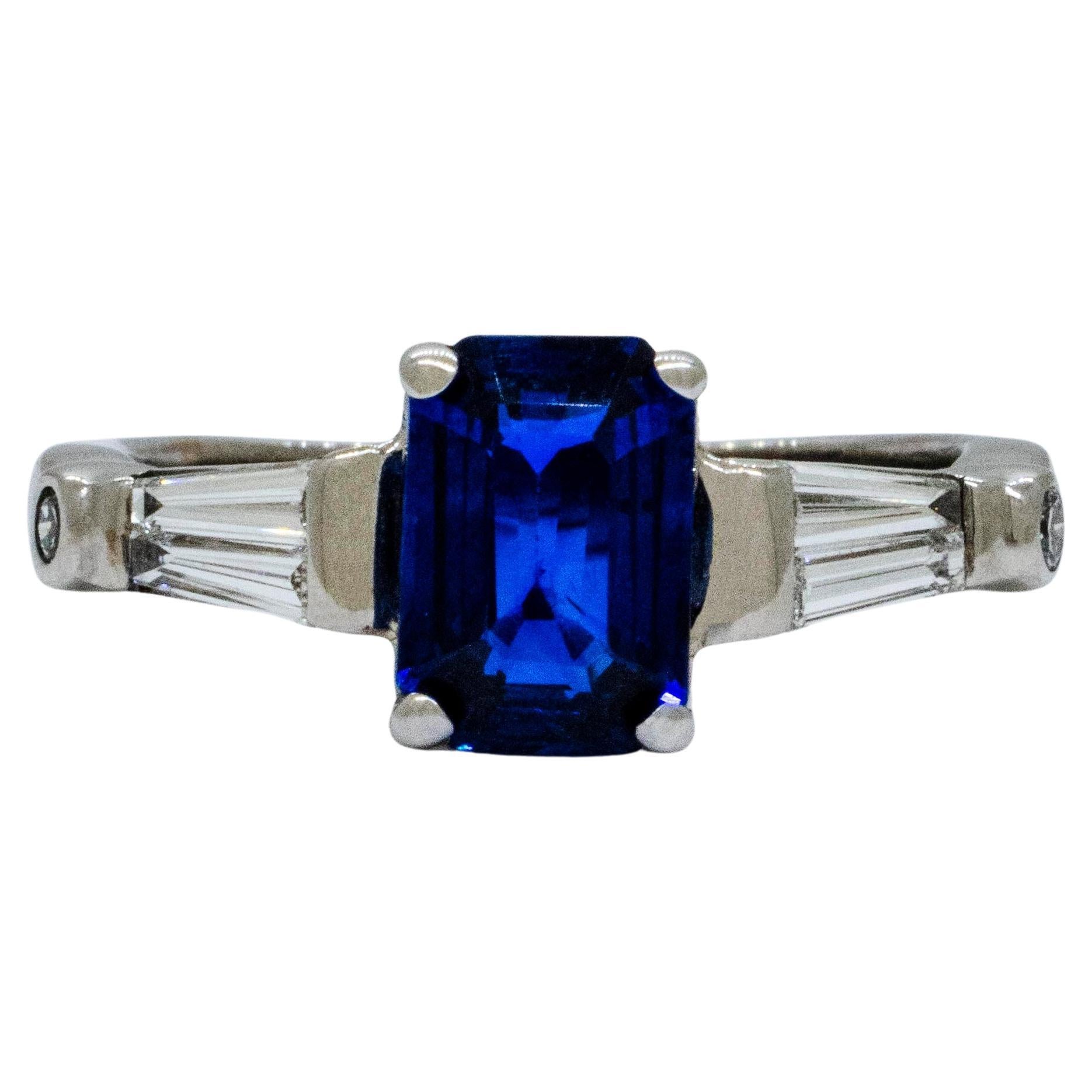 An 18k White Gold Ring with Blue Sapphire and Baguette Diamonds