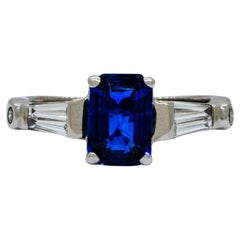 An 18k White Gold Ring with Blue Sapphire and Baguette Diamonds