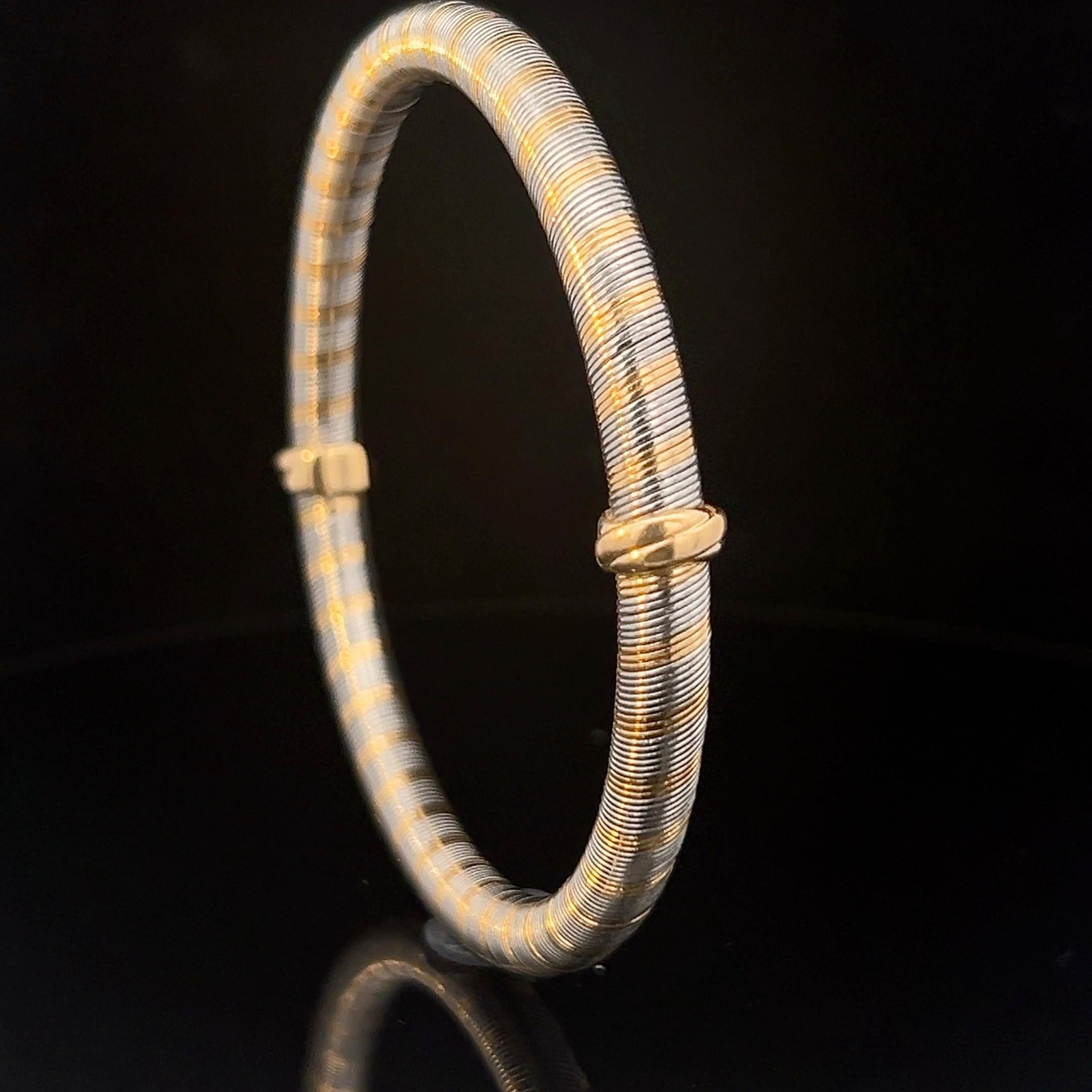 Ein Armreif aus 18 Karat Gelbgold und „acier“ von Cartier. im Angebot 6