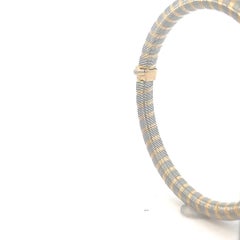 Bracelet en or jaune 18 carats et acier de Cartier.