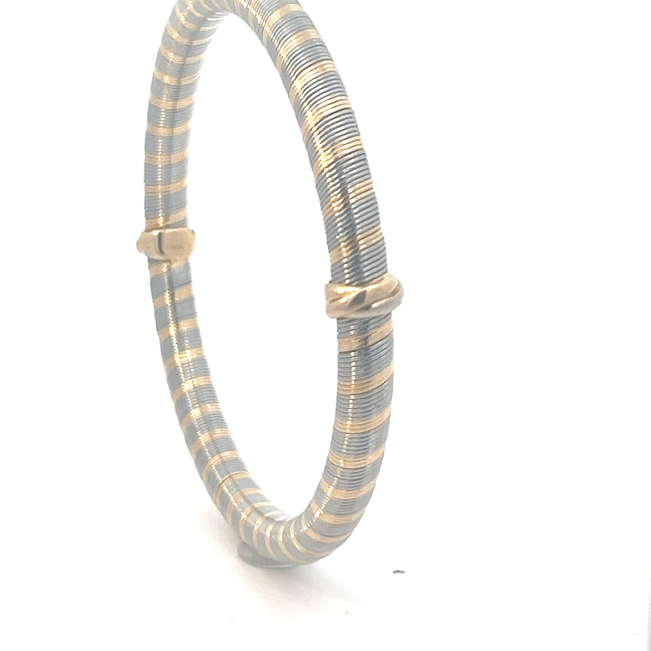 Ein Armreif aus 18 Karat Gelbgold und „acier“ von Cartier. Damen im Angebot