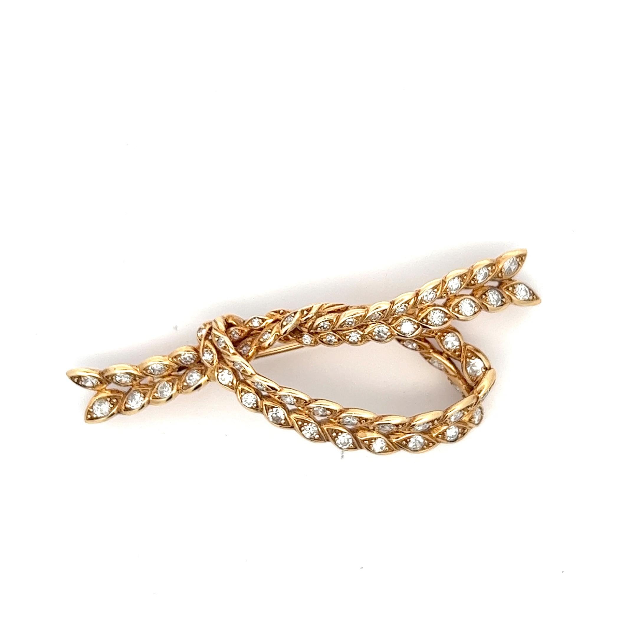 An 18k yellow gold bow brooch by Sterlé.
The brooch was made in France, circa 1960.
Total Diamond weight: circa 3.8ct.

The brooch measures circa 7 by 3 cm.

The brooch is marked with the French hallmark for 18k gold.
Signed: Sterlé. Stamped with