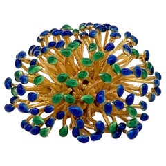An 18k yellow gold and enamel brooch by W. Teller.