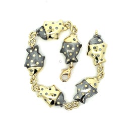 An 18k yellow gold and burnished steel bracelet by Faraone / Tiffany & Co.