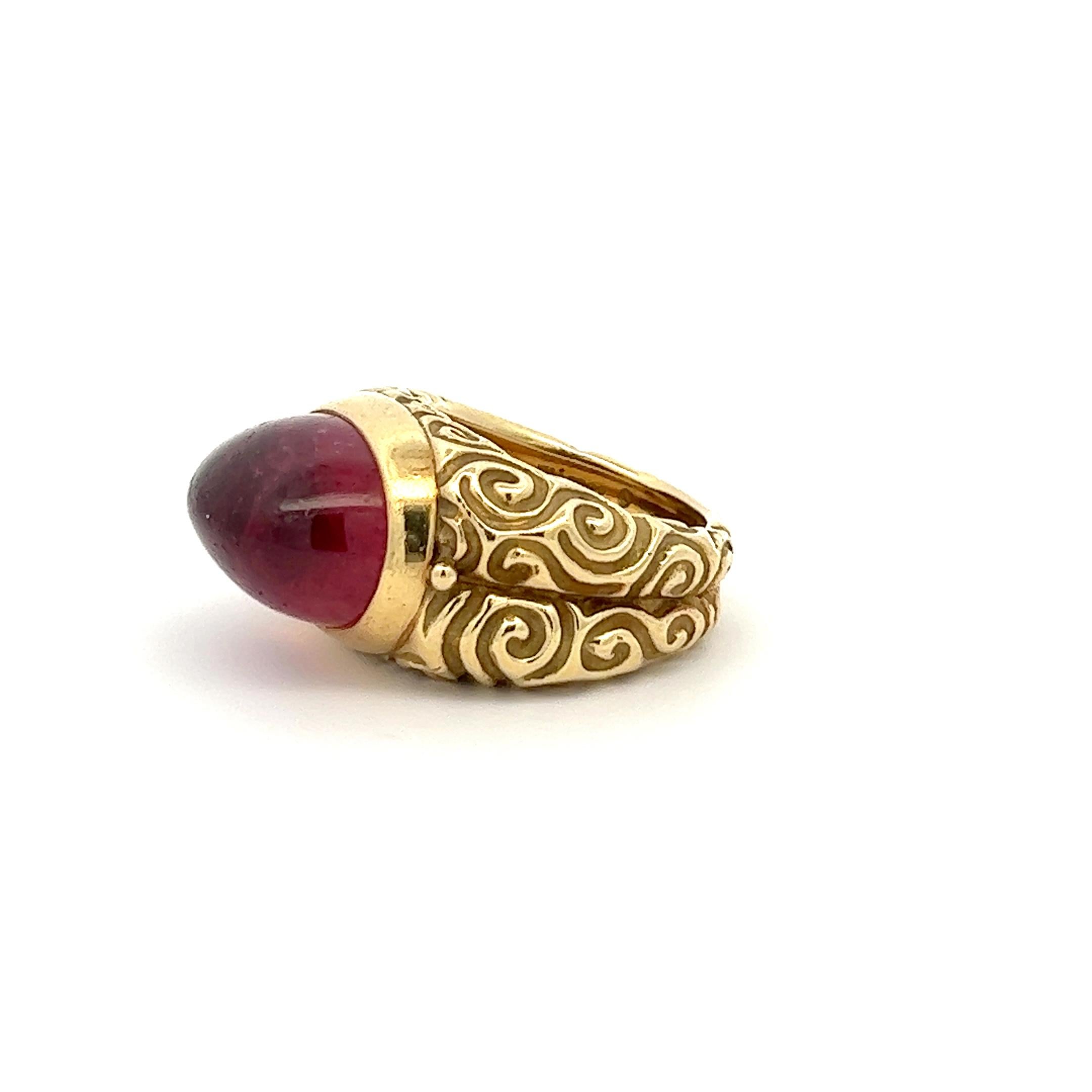 An 18k yellow gold and pink Tourmaline ring by Elizabeth Gage.

Origin: London, UK.
Ahe: 2018.
Ring size: 59.
Weight: circa 30.4 grams.
Marked with the UK hallmark for 18k gold and for London 2018. Also marked with the UK makers mark for Elizabeth