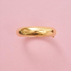 An 18k Yellow Gold Bangle