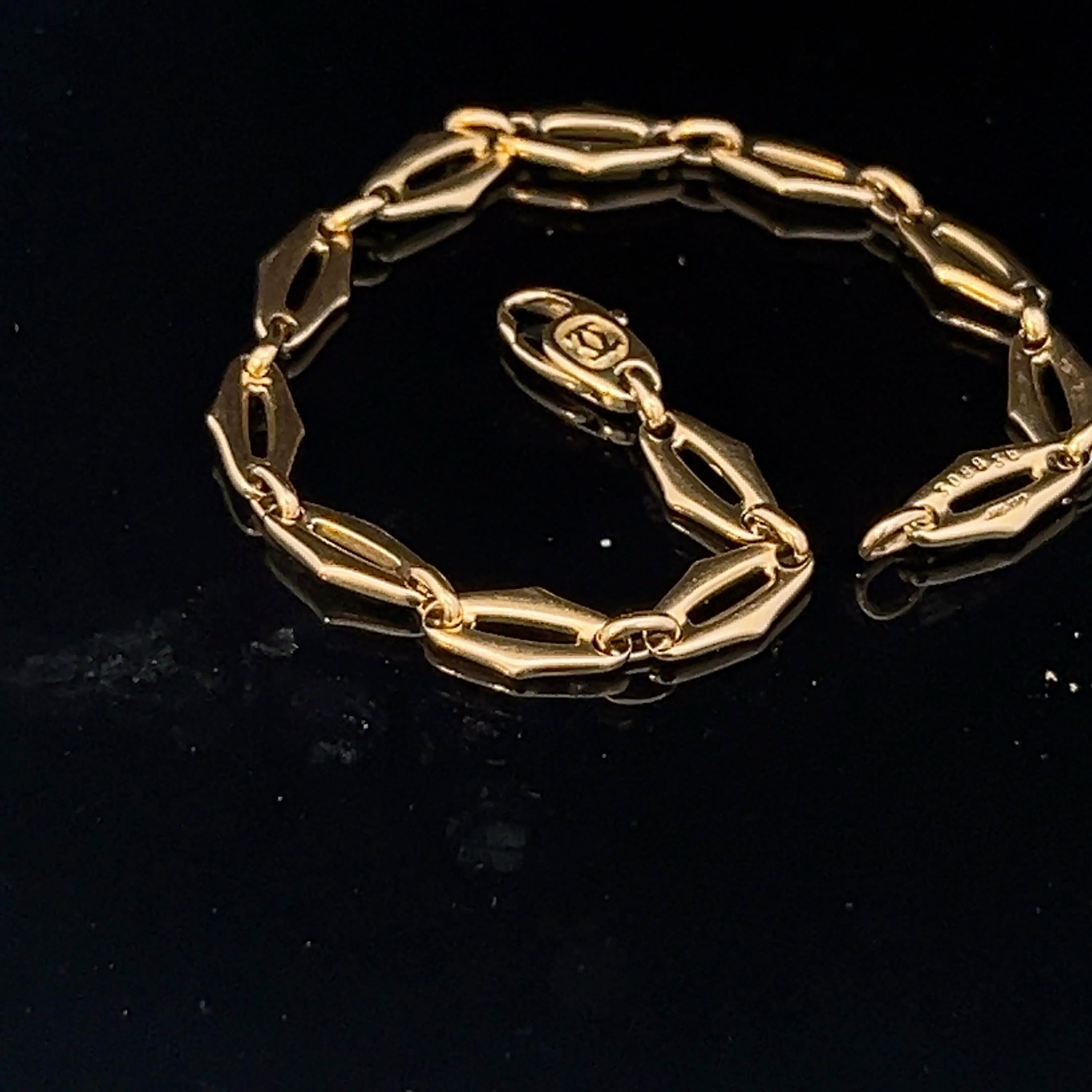 An 18k yellow gold bracelet by Cartier. 4