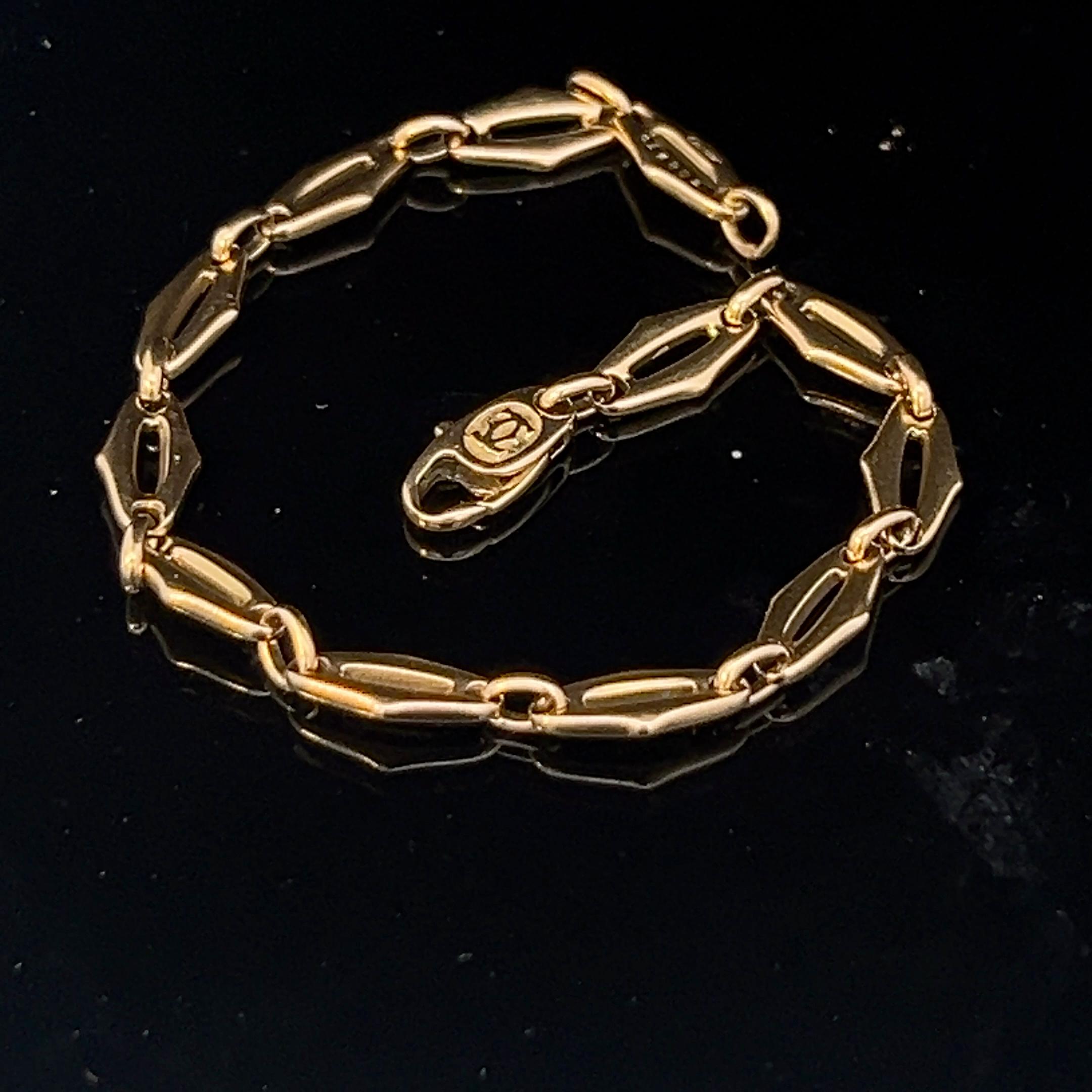 An 18k yellow gold bracelet by Cartier. 5