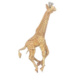 An 18k yellow gold, diamond and sapphire giraffe brooch by Tiffany & Co.