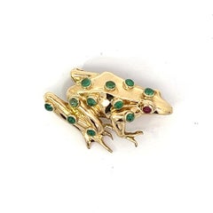 An 18k yellow gold, emerald and ruby frog brooch by Theo Fennell