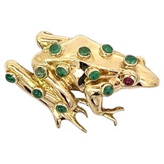 An 18k yellow gold, emerald and ruby frog brooch by Theo Fennell