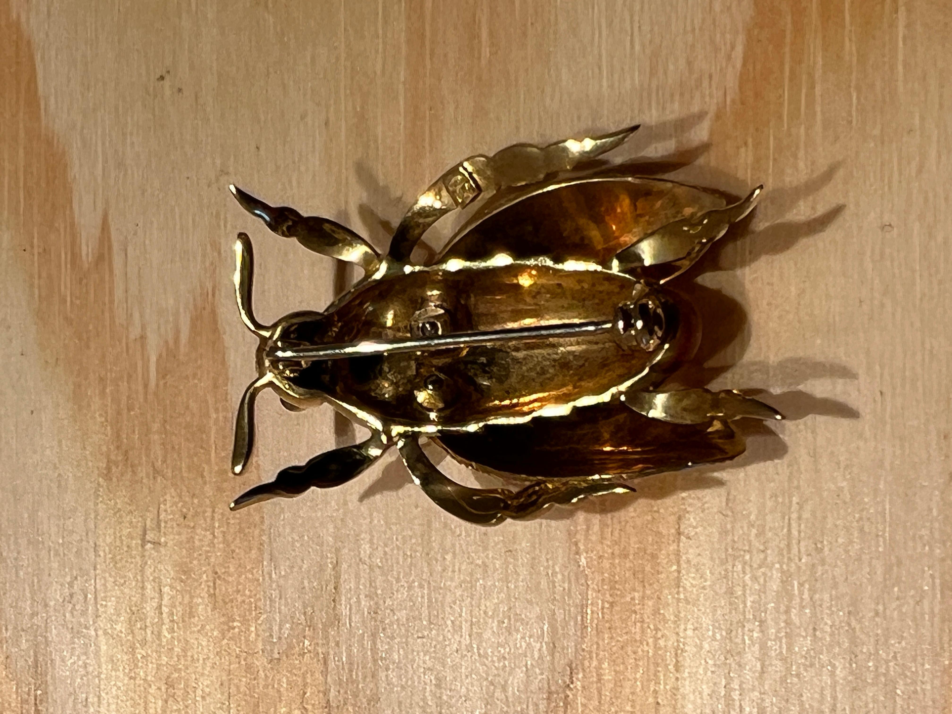 An 18k yellow gold, enamel and Diamond beetle brooch by Marco Rigoni.  1