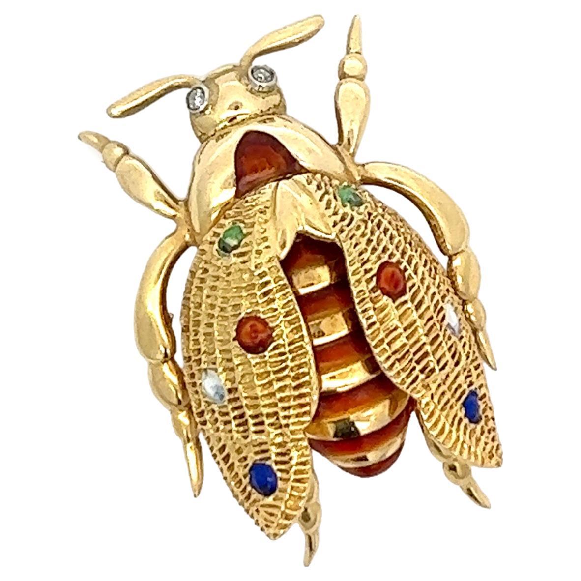 An 18k yellow gold, enamel and Diamond beetle brooch by Marco Rigoni. 